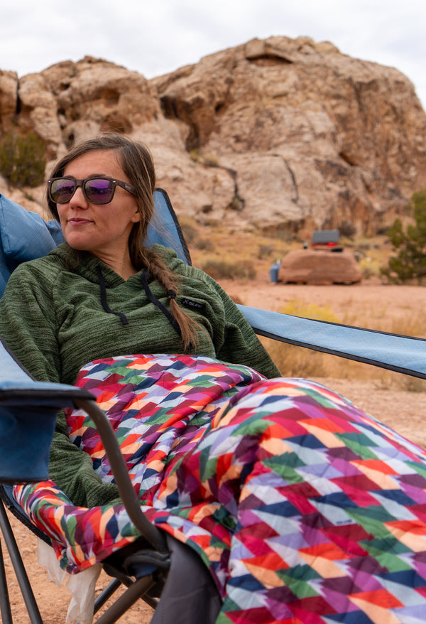 A Woman Hiker with Puffy Kachula Adventure Blanket Wearing Evolution Hoodie